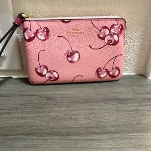 Coach Pink Wristlet with Cherry Design